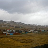 As we continued drifting towards Mongolia's capital, the sun was swallowed by clouds, dunes morphed into frozen, cracked earth, and miniature horses appeared, clinging to the exposed, fruitless plains...