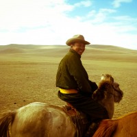 Riding horseback with nomads in Mongolia. Like traveling back to the time of Ghengis Khan, this was a pretty surreal experience. I took a video too, which you can check out here if you like! :)