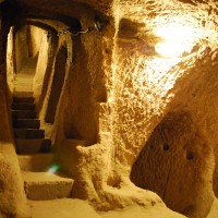 Never in my life have I seen such extraterrestrial housing. Entire villages underground. Giant rocks in the likeness of penises rushing past on the left and on the right. Where ARE we?